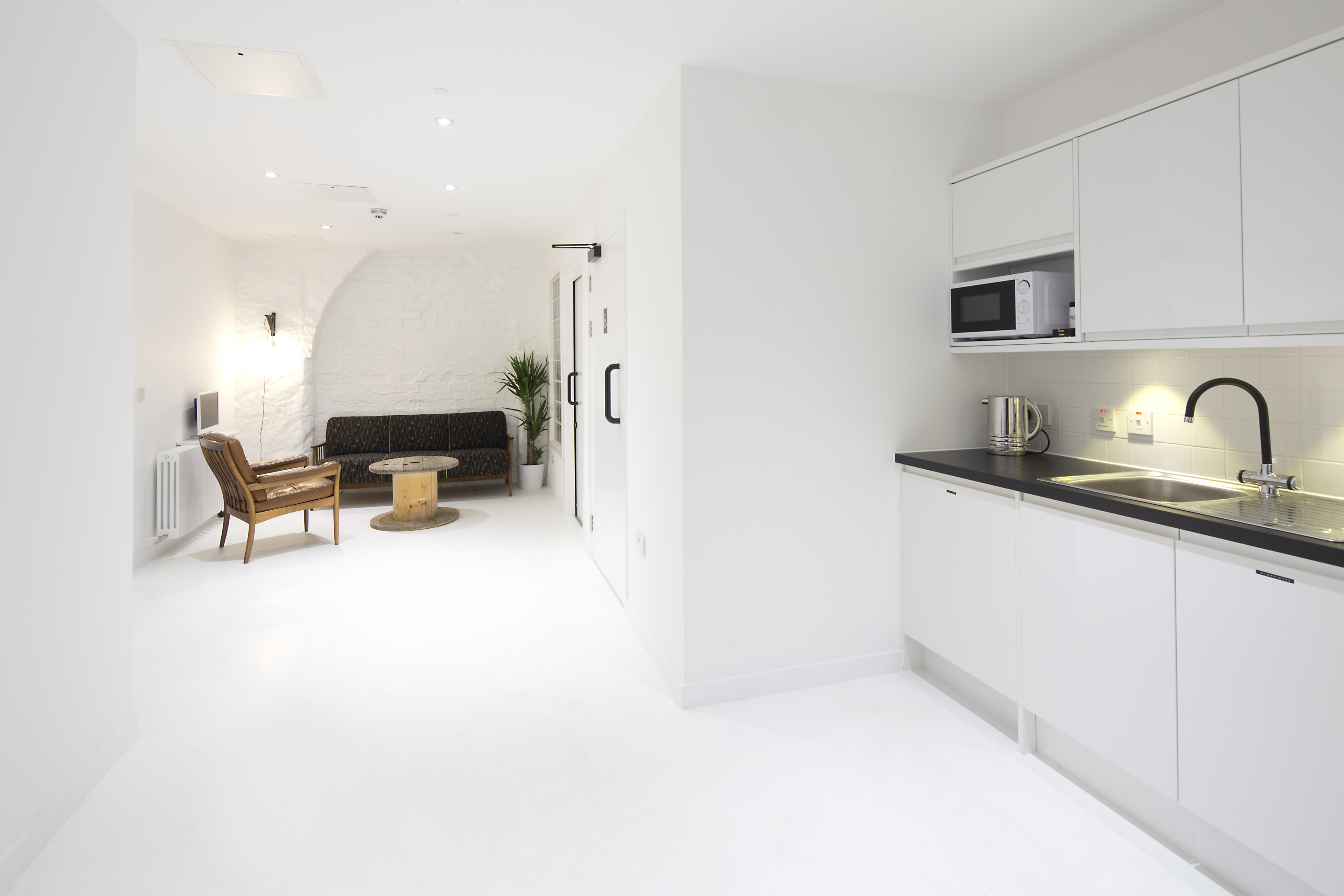 Sika ComfortFloor® white floor in completely white interior of home kitchen